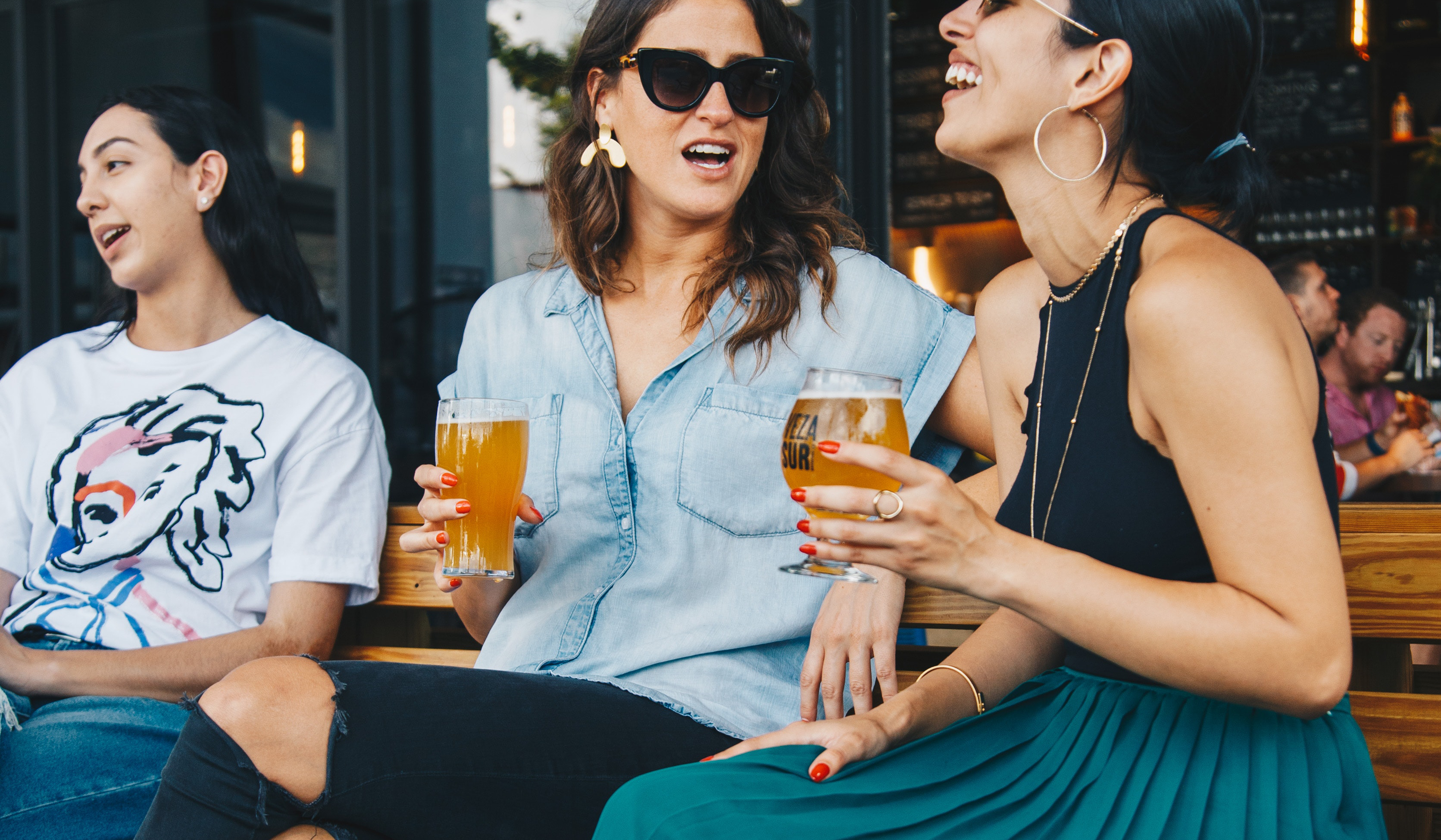 People Enjoying A Brewery